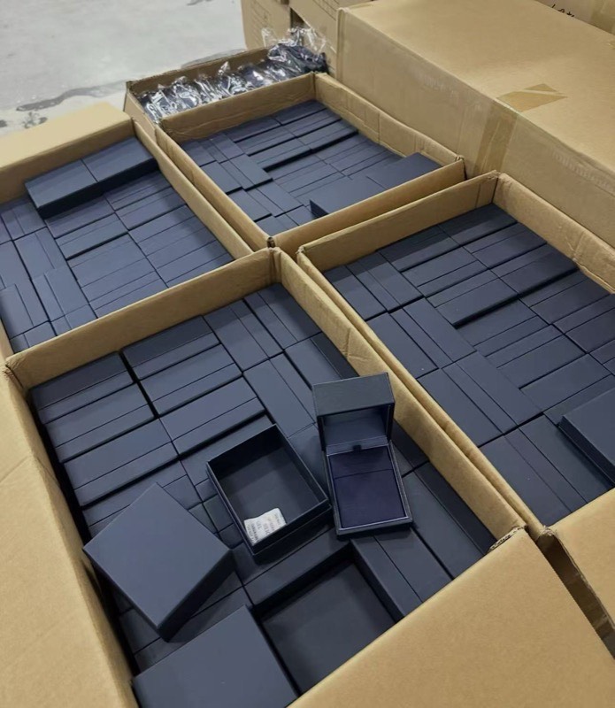 Black product boxes packed in cartons