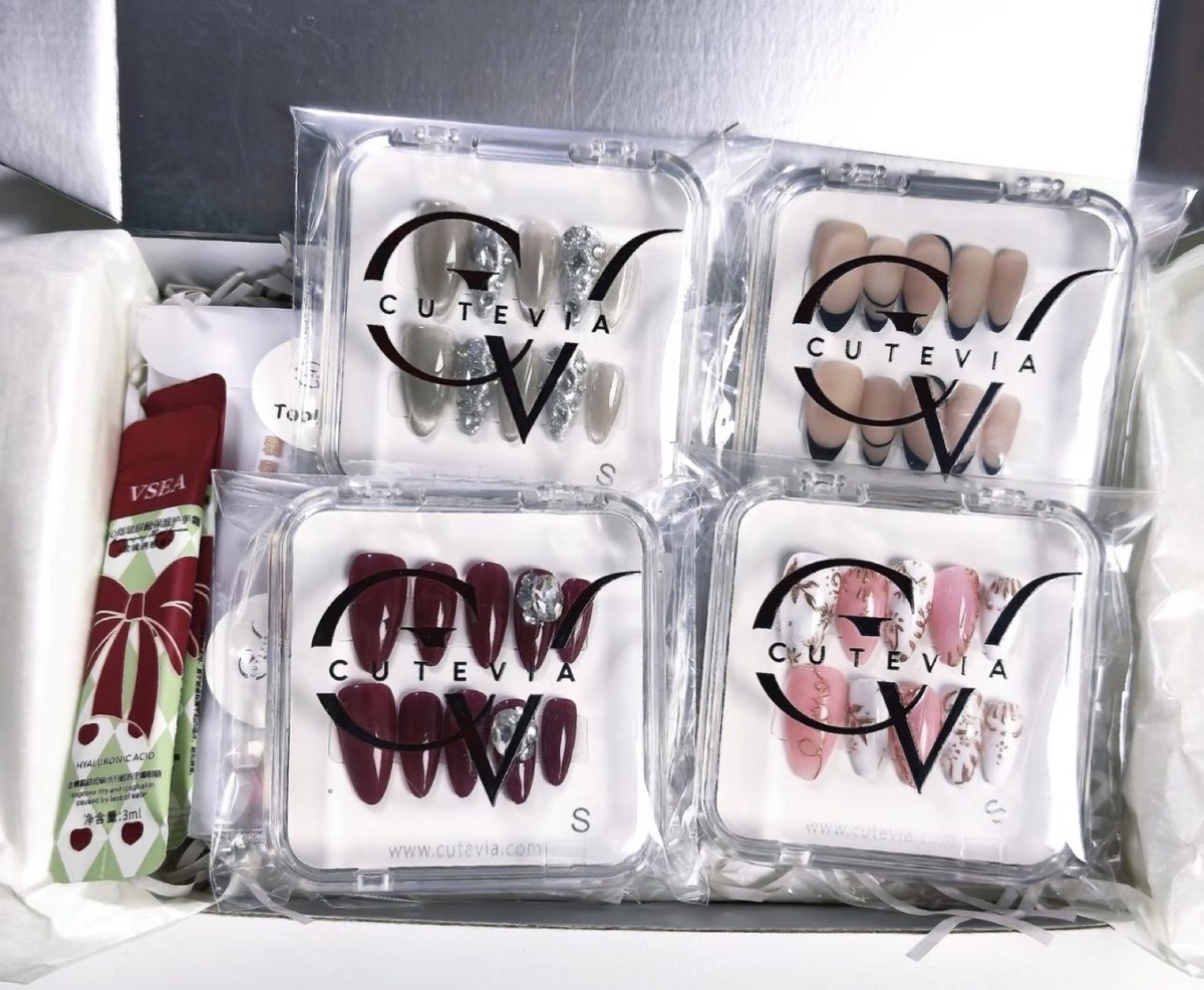 Custom branded press-on nails packaging with logo for a client brand