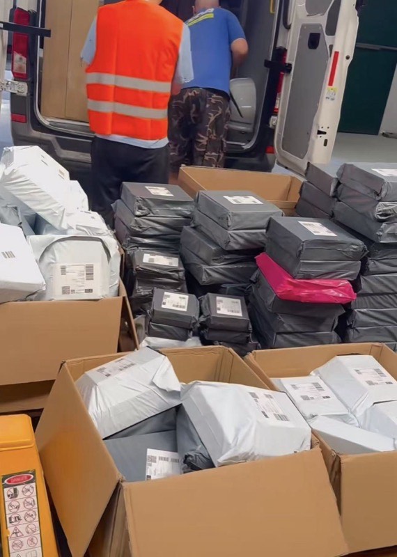 Loading parcels into a delivery van