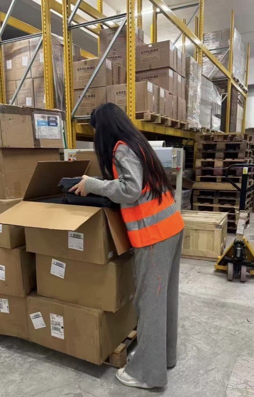 Inspector checking goods in warehouse